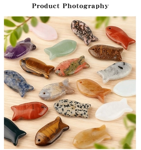 Macro detail of various natural gemstone fish charms with pre-drilled holes for DIY jewelry
