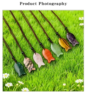 Set of seven natural stone fish pendants in assorted colors with brown braided cords