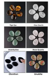 Set of six natural stone drop-shaped massage tools including amethyst and tiger eye