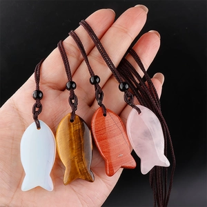 Natural agate fish-shaped pendants in tiger eye and rose quartz on woven cords