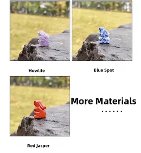 Detailed rabbit figurines carved from howlite, blue spot, and red jasper natural stones