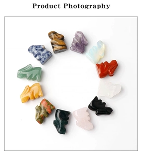 Top view of twelve mini rabbit carved stones made from amethyst and natural quartz