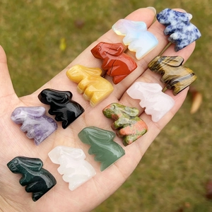 Collection of 12 hand-carved natural crystal rabbit figurines in various gemstones