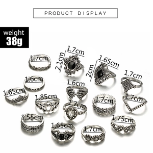 Set of 15 vintage silver geometric rings featuring floral crown and black gemstone designs