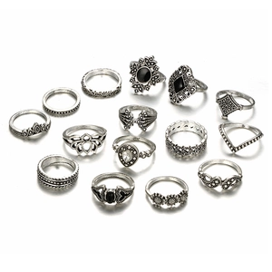 Detail view of 14-piece vintage silver ring set with black stones and bohemian motifs