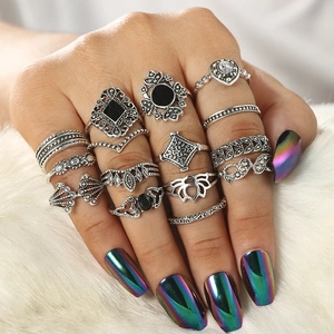 Set of 15 vintage silver geometric rings with black heart and lotus carvings