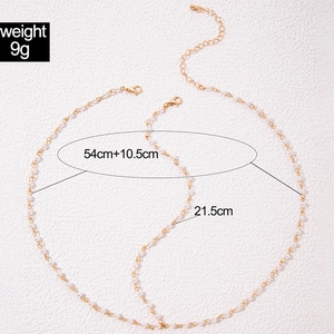 Detail of pearl chain hair accessory with dimensions 54cm plus 10.5cm extension chain