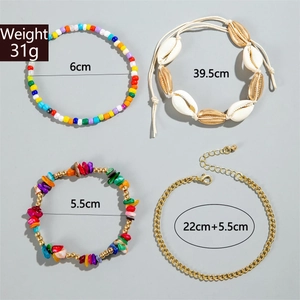 Macro view of four-piece bohemian shell and bead anklet set with size details