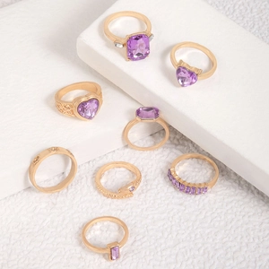 Eight-piece gold ring set with purple heart crystals and snake motifs for women