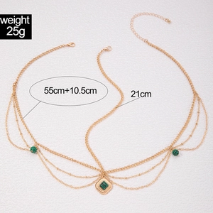 Exotic golden head chain with green malachite-style beads and multi-layered bohemian design