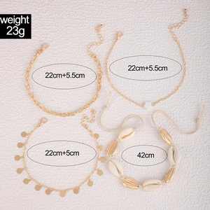 Detail of 4-piece beach anklet set featuring cowrie shells and gold-toned chains