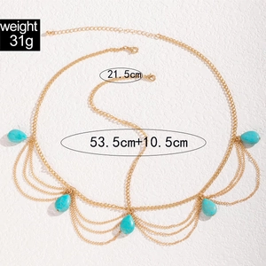 Detailed view of layered gold body chain with blue teardrop rhinestones and sizing data