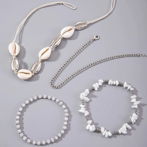 Detail view of 4-piece bohemian shell jewelry set with silver metal and natural beads