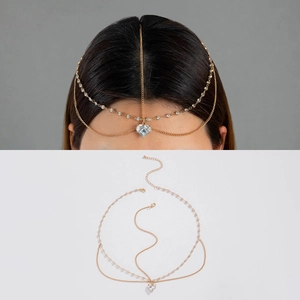 Detailed view of bohemian gold head chain with crystal heart pendant and adjustable clasp
