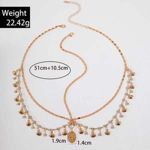 Detail of gold pearl chain headband with shell charms and size dimensions shown