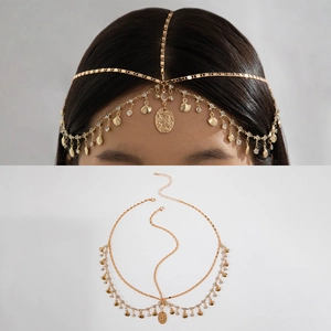 Detail of bohemian gold layered head chain with metallic discs and shell pendants