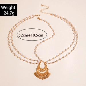 Exotic gold layered head chain with crescent moon pendant and pearls details