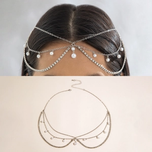 Detail of bohemian silver chain headpiece with white pearls and sparkling rhinestones
