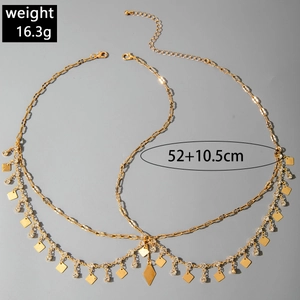 Detailed view of layered gold chain headpiece with diamond charms and 10.5cm extension