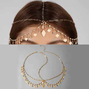 Close-up of golden pearl chain headpiece with diamond sequins and exotic fringe detail