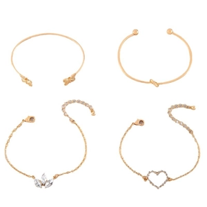Elegant 4-piece gold bangle and bracelet set with heart, leaf, and butterfly motifs