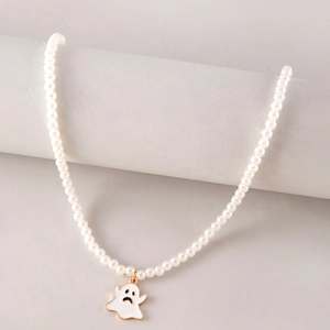 Ghost pearl necklace with white enamel ghost pendant on a gray jewelry display stand
