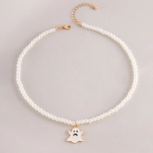 Detailed view of pearl necklace with white ghost pendant and gold lobster clasp