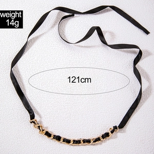 Detail view of 121cm black satin ribbon belt with gold metal woven chain accent