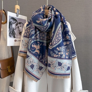 Navy blue paisley cashmere-like scarf with warm orange floral prints and tassel edges
