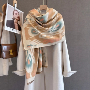 Beige cashmere-like winter shawl with ethnic geometric patterns and stylish soft fringes