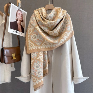Detail of cashmere feel pashmina with vintage paisley pattern and tassel edges