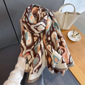 Winter cashmere feel shawl with paisley patterns and tassels for cozy warmth