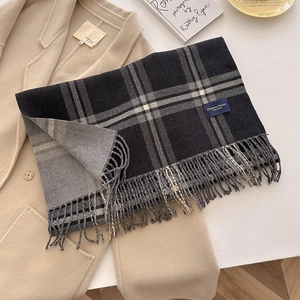 Autumn black and white plaid scarf with tassels on khaki coat, cashmere-like texture