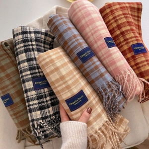 Thick knit plaid scarf with fringe tassels in various colors and soft cashmere-like texture