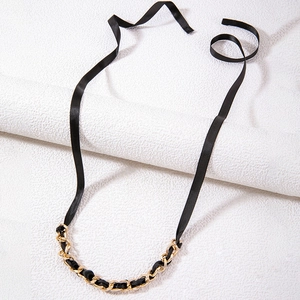 Vintage chunky gold chain necklace with black ribbon ties and ribbon bow detail