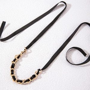 Retro ribbon bow necklace with bold gold chain link and black silk strap detail