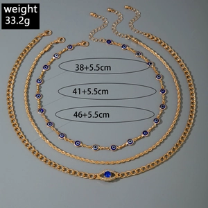 Gouden gelaagde kettingset met blauwe Evil Eye hangers en diverse schakels
