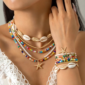 Bohemian beach jewelry set with colorful beads, starfish charms, and sea shells