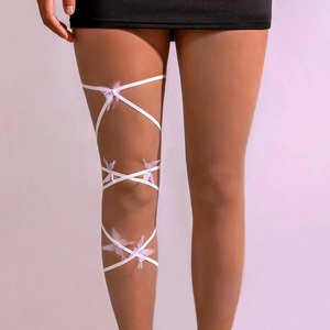 Detail view of white elastic leg chain with lavender butterfly accents and rhinestones