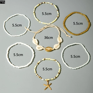 Detailed set of 7 Bohemian style shell and starfish beaded bracelets and necklace