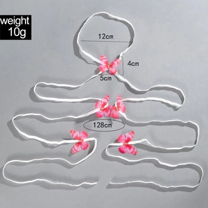 Detail view of pink butterfly leg chain with elastic straps and rhinestones 128cm length