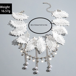 Detailed view of white lace choker with butterfly charms and faux pearl accents