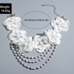 Detailed view of white floral lace choker featuring pearl layers and dimensions label
