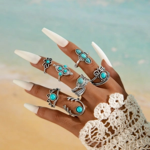 Set di 7 anelli vintage color argento con pietre turchesi e motivi a piuma