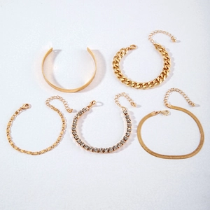 5-piece gold bracelet set with cuban link, tennis chain, and flat snake bone chain style