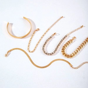 Chic 6-piece gold alloy bracelet set featuring flat bangle, snake, and Cuban link chains