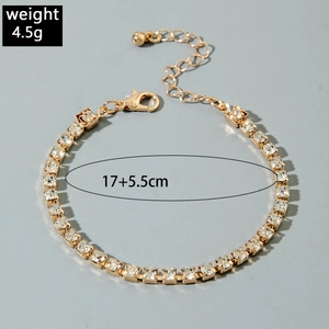 Detail of gold-plated bracelet with clear rhinestones and adjustable lobster clasp