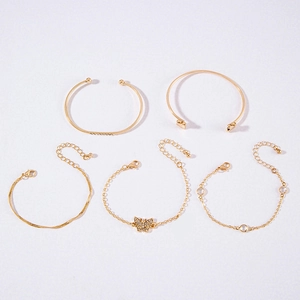 5-piece gold bracelet set with twisted cuff, butterfly charm, and snake chain detail