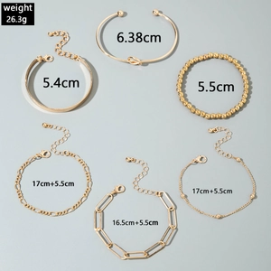 Detailed flat lay of 6pcs gold-plated punk bracelets set with twist and paperclip links