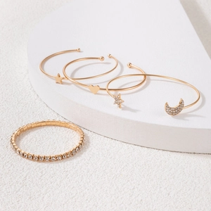Detailed view of 5pcs gold-tone bracelet set with moon, star, and heart charms
